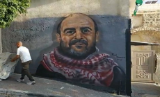 جدارية الشهيد نزار بنات في مدينة الخليل.png