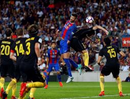 جانب من مواجهة سابقة بين برشلونة وأتلتيكو