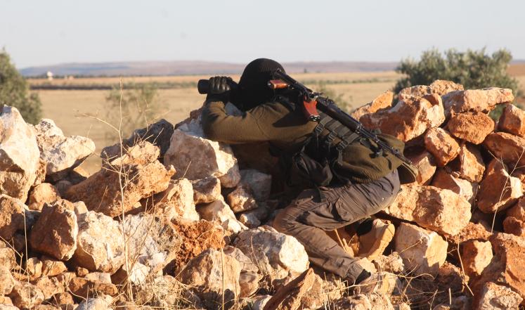 صورة "أرشيفية" لمعارك في جلب بين النظام السوري والمعارضة