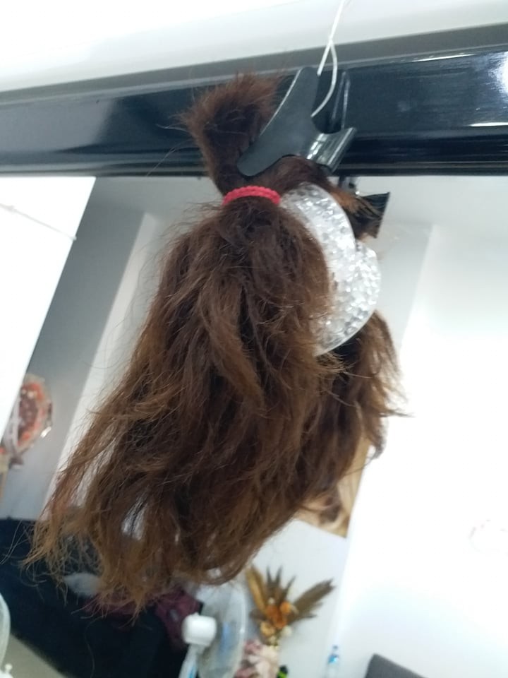 صورة لسيدة تبرعت بشعرها