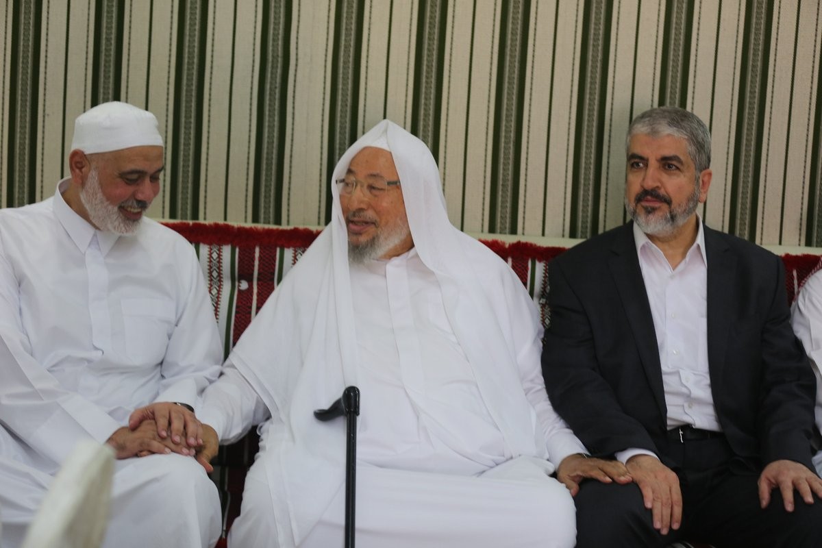 مشعل والقرضاوي