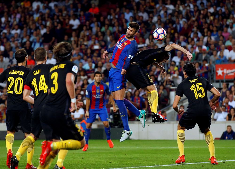 جانب من مواجهة سابقة بين برشلونة وأتلتيكو